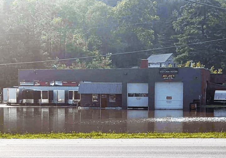 Garage in Center Rutland surrounded by water during flooding.