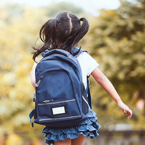 Back to school. Cute asian child girl with backpack running and going to school with fun