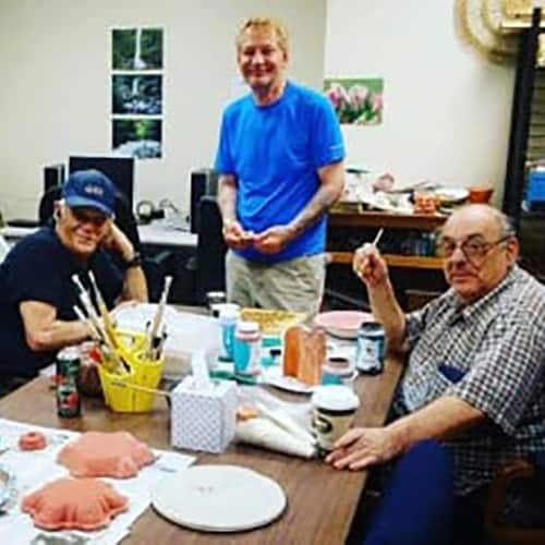 Several men sitting around the table at Turning Point.